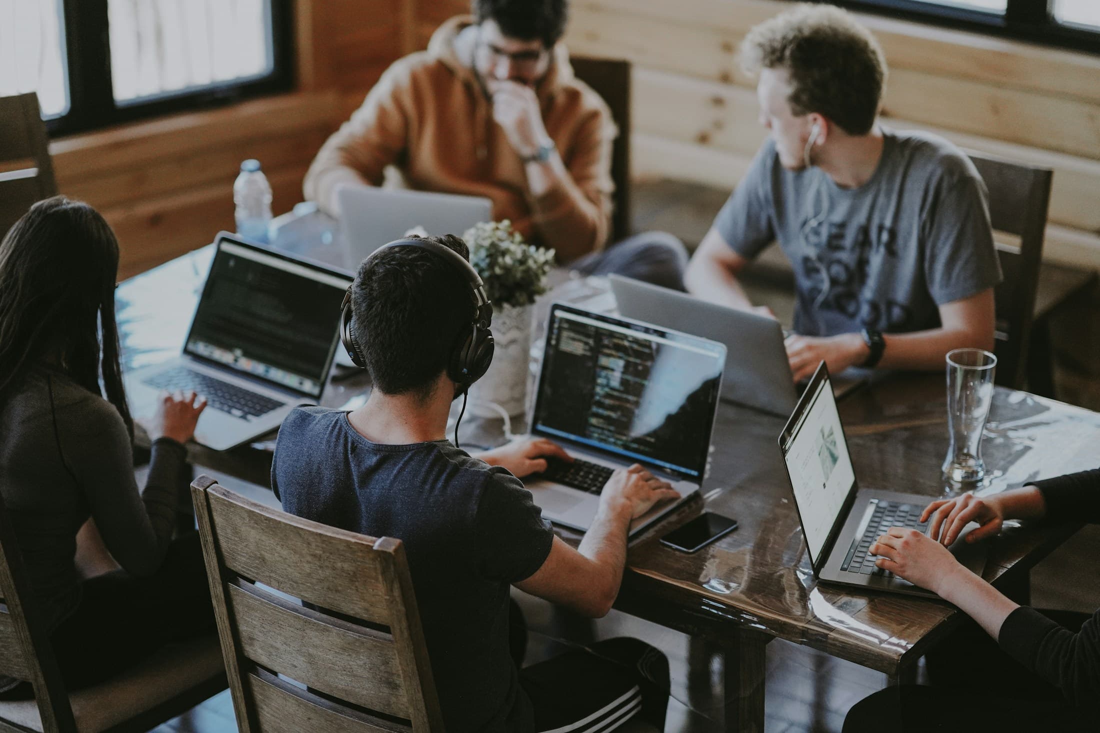 A real team working together around connected digital systems.